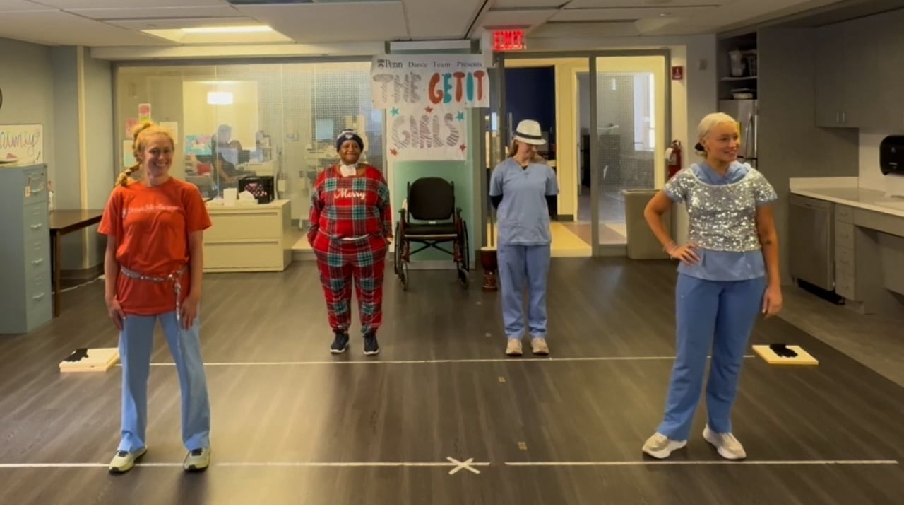 Penn Medicine Rehabilitation recreation therapists perform a choreographed dance with patient Monica inside the inpatient rehabilitation unit in Philadelphia